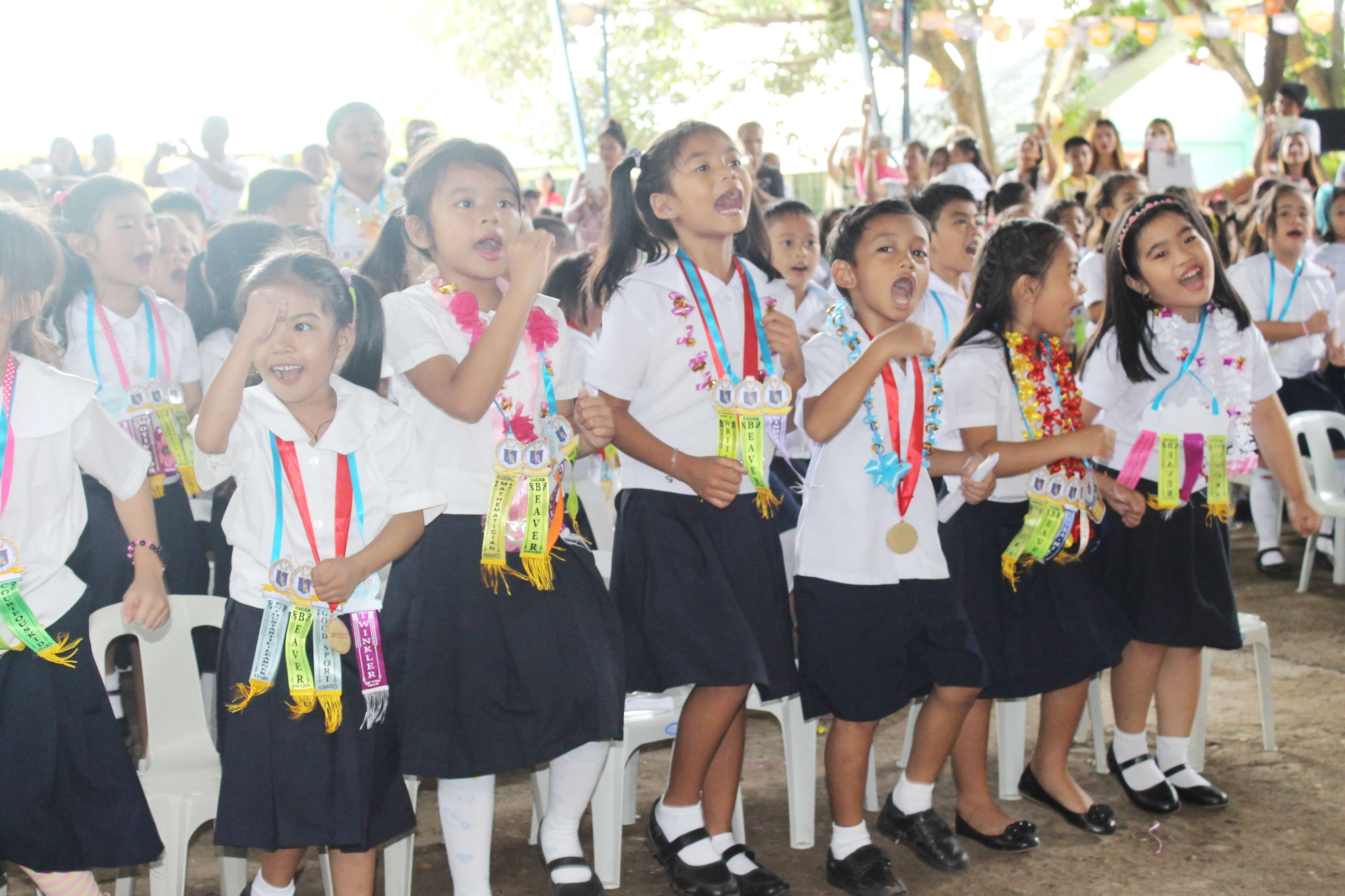 Students of Doña Asuncion Hizon Elementary School in Davao City move up